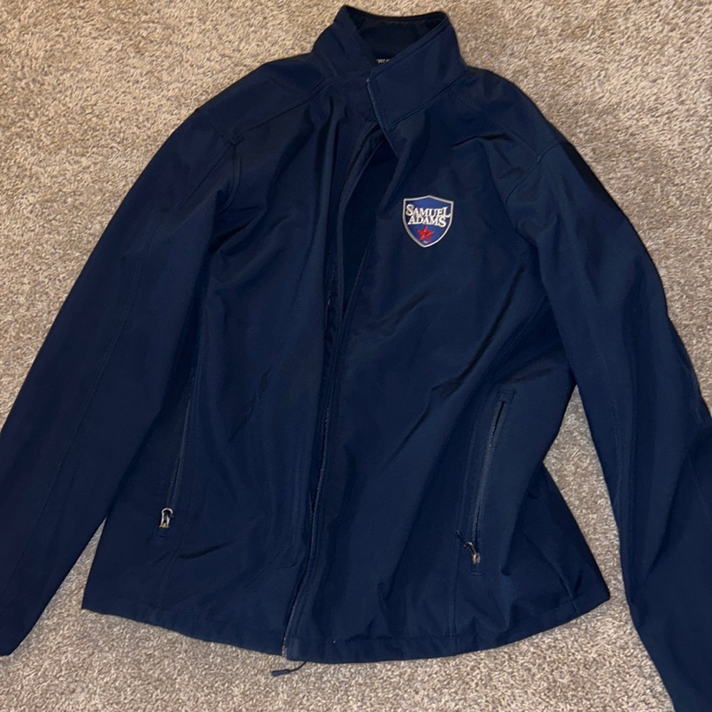Navy full zip jacket with “Samuel Adam’s” embroidered.